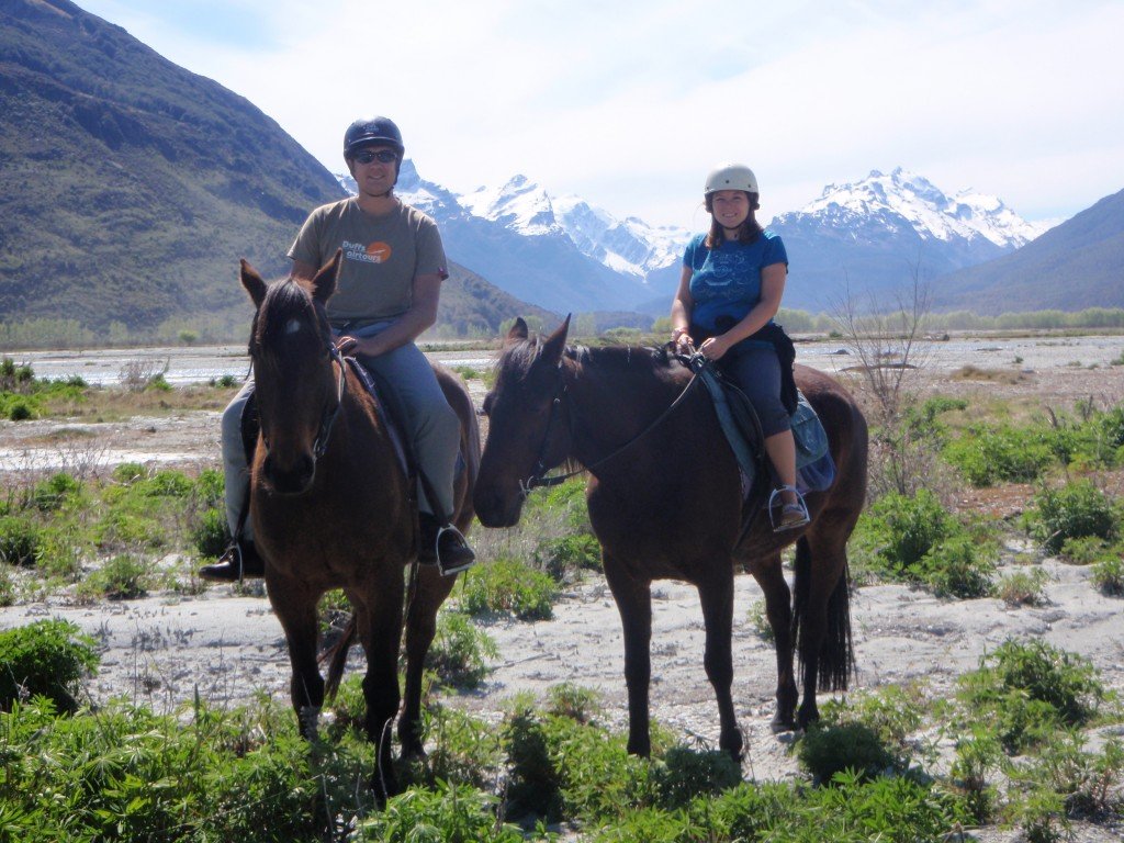 Couple horse riding in New Zealand