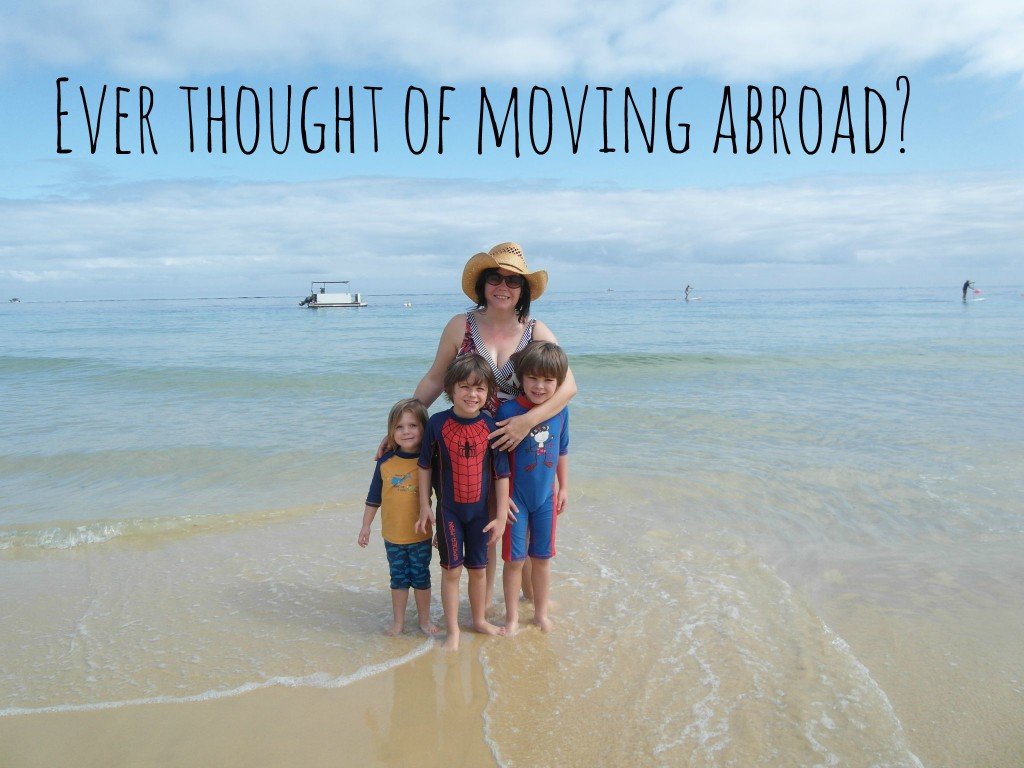 A family on a beach - moving abroad