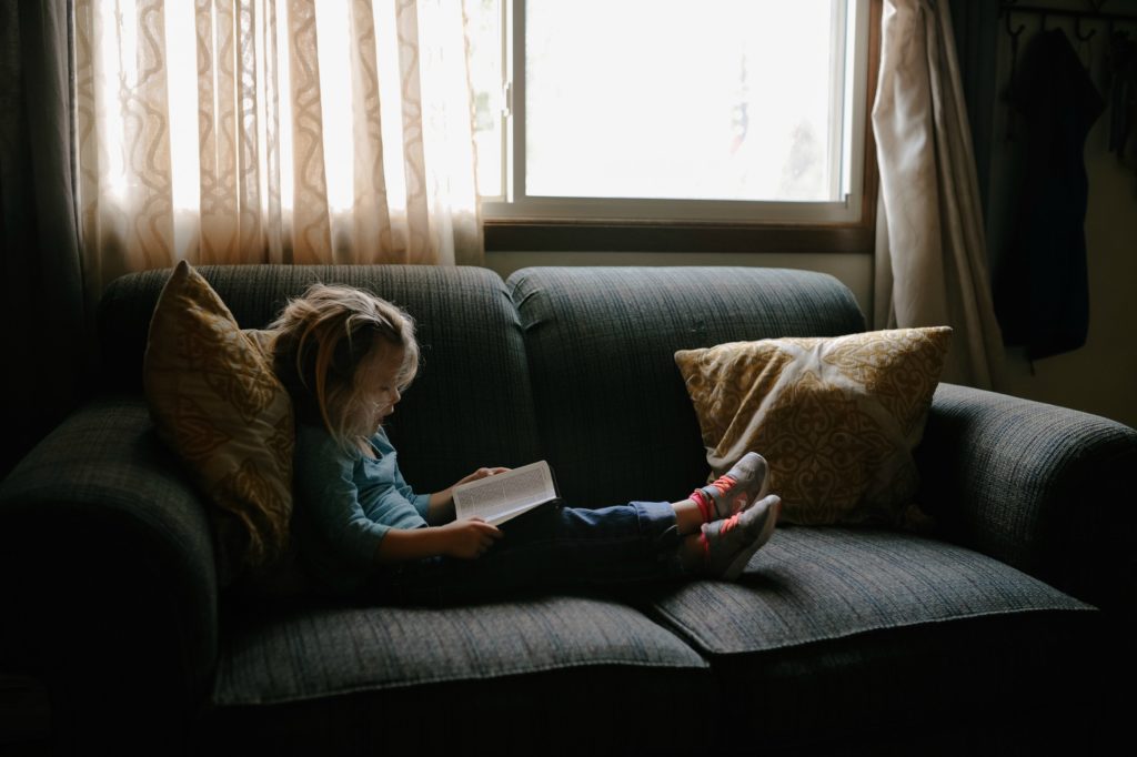 Girl on a sofa - secrets to a calmer, more organised family life