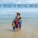 A family on a beach - moving abroad